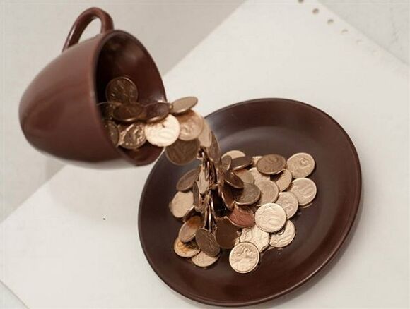 A bowl of coins attracts money