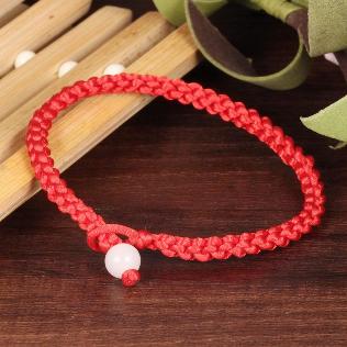 A bracelet of red thread